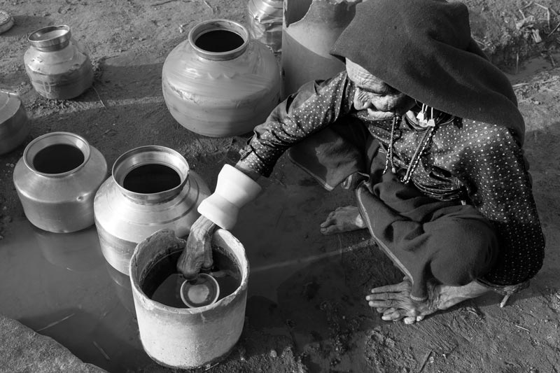 Human Right to Water in Kutch district, Gujarat - Drawing water from a valve leakage